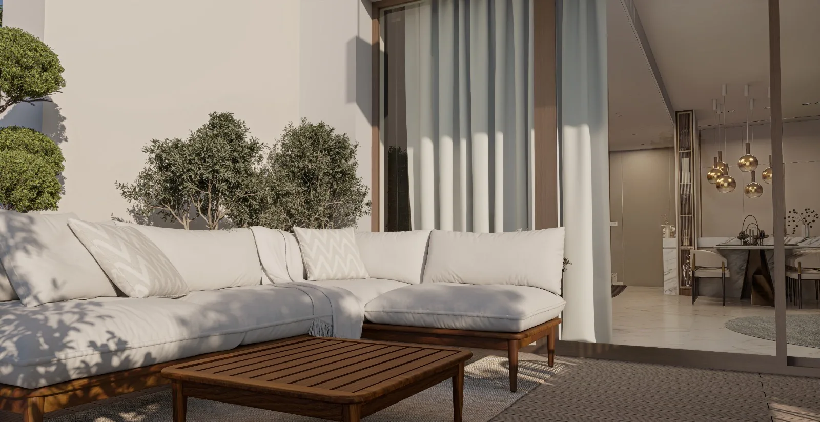 Outdoor sectional under olive trees with wooden side tables — coastal-durable finishes.