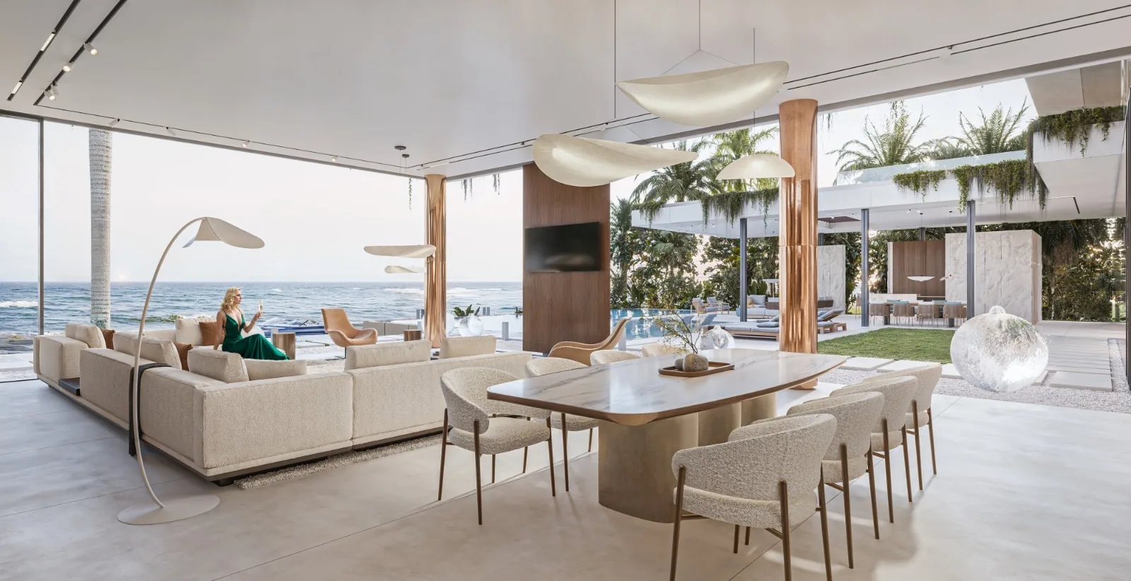 Cream-toned waterfront living room with ocean views through wall-height glazing.