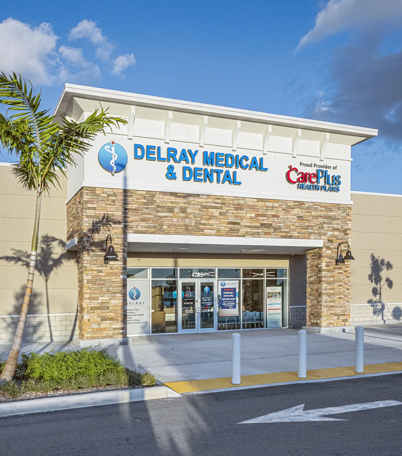 Delray Medical & Dental exterior — brick facade and glass entrance.